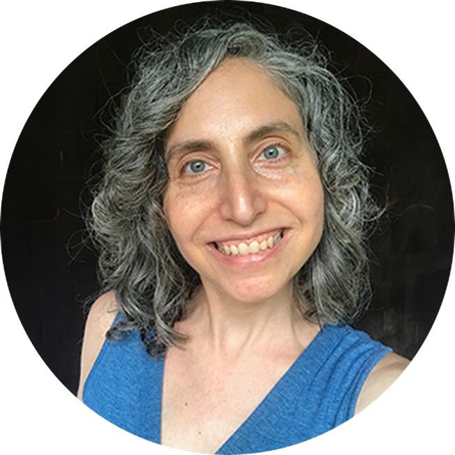 Ovarian cancer survivor Jennifer Garam. An older white woman with gray wavy hair, smiling at the viewer. She is wearing a blue top.