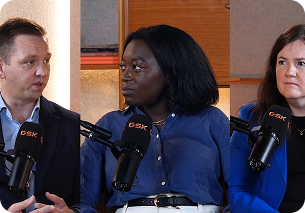 This is a link to a video. The image is split into three frames as it is a panel, with all three wearing blue shirts.