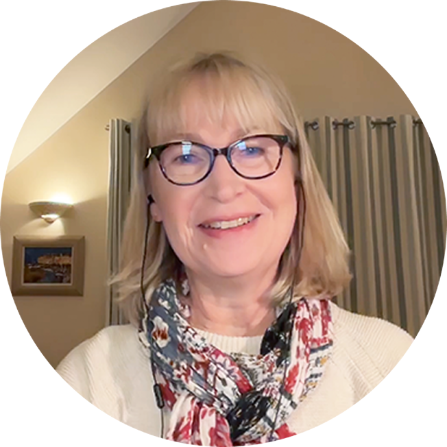 Patient advocate Helen White, an older white woman with shoulder-length blonde hair and wearing black glasses, is smiling at the viewer.