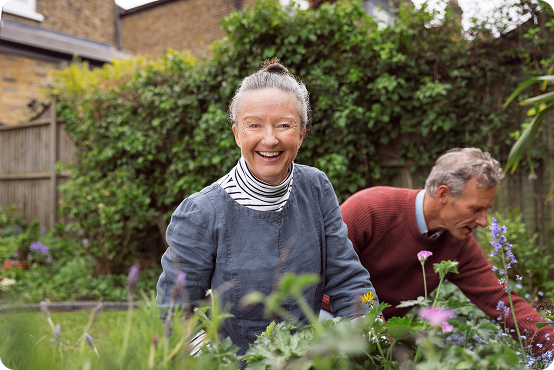 An older couple gardening.