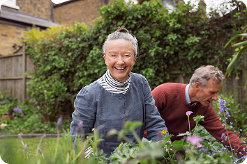 An older couple gardening.